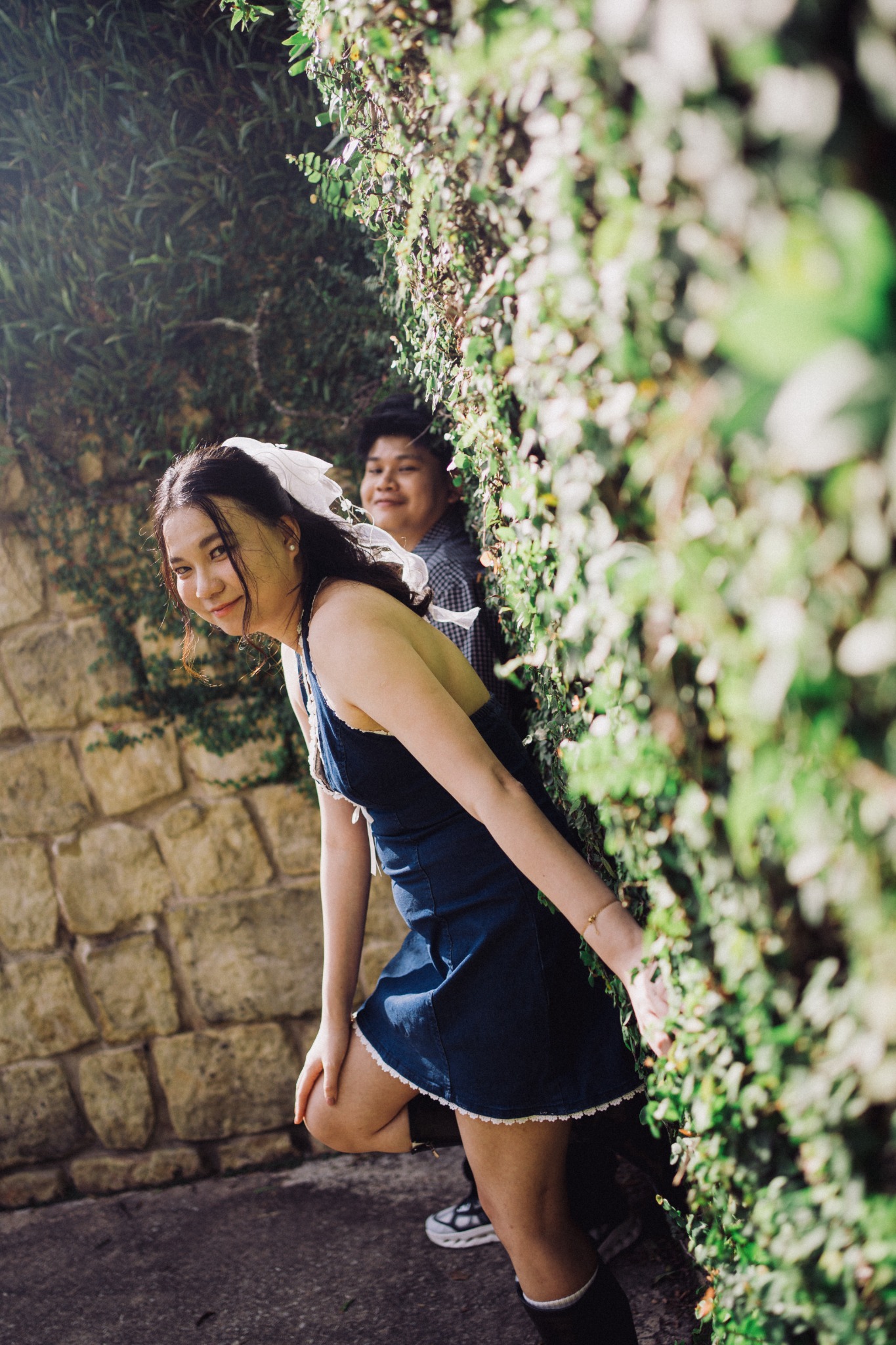 Dillan and Rowena together by an ivy wall